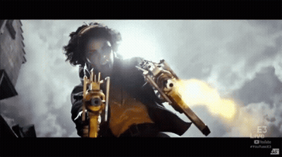 Woman Holding Gun In Front Of YouTube Live Logo GIF