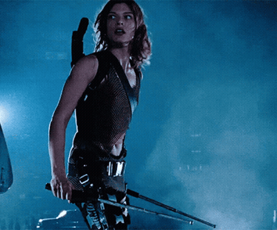 Woman Holding Gun With Tokyo On Belt GIF