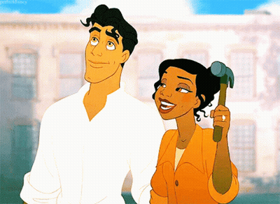 Woman Holding Hammer Beside Man GIF