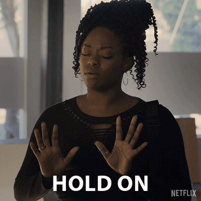 Woman Holding Hands Up At Netflix Logo GIF
