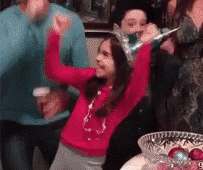 Woman Holding Hands Up In Front Of Birthday Cake GIF