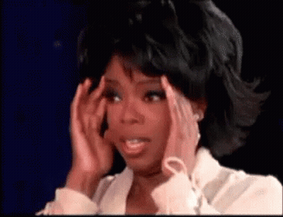 Woman Holding Head In Pain On TV Show GIF
