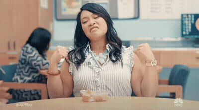 Woman Holding Head In Pain On TV Show GIF