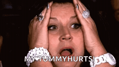 Woman Holding Head Saying My Tummy Hurts GIF