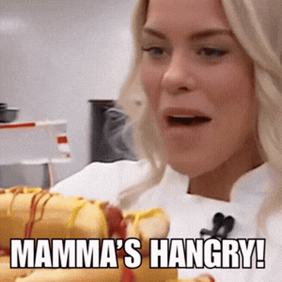 Woman Holding Hot Dogs Saying Mamma's Hangry GIF