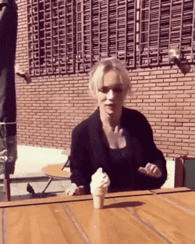 Woman Holding Ice Cream Cone GIF