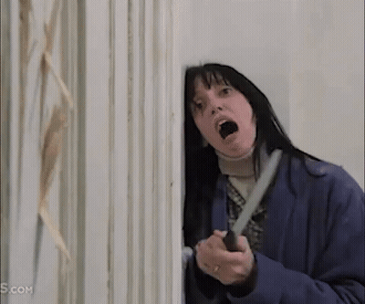 Woman Holding Knife In Front Of Door GIF