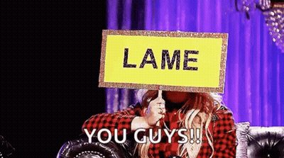 Woman Holding Lame You Guys Sign On Couch GIF