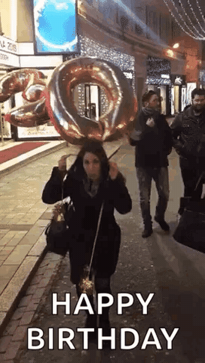 Woman Holding Large Balloon And Sparkler GIF