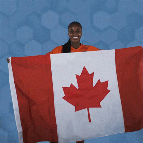Woman Holding Large Canadian Flag GIF