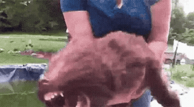 Woman Holding Large Chicken