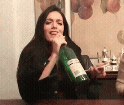 Woman Holding Large Green Wine Bottle GIF