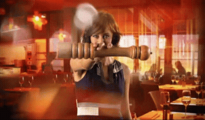 Woman Holding Large Pepper Mill GIF