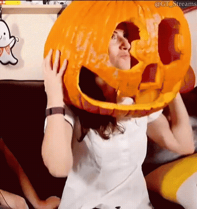 Woman Holding Large Pumpkin On Head GIF