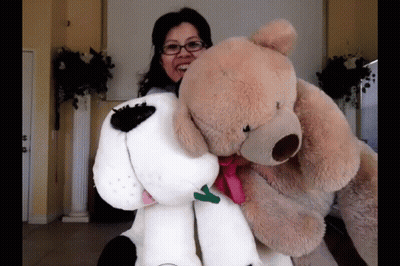 Woman Holding Large Teddy Bear And Stuffed Dog GIF