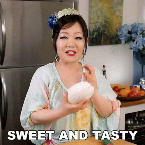 Woman Holding Large White Object Sweet And Tasty GIF