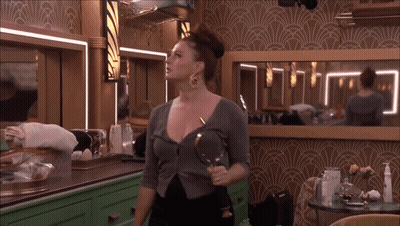 Woman Holding Magnifying Glass At Mirror GIF