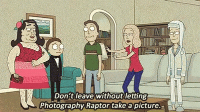 Woman Holding Man's Arm In Living Room With Cartoon Characters GIF