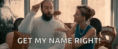 Woman Holding Man's Head On Couch GIF
