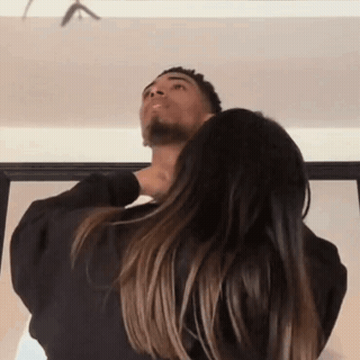 Woman Holding Man's Neck Looking Up GIF