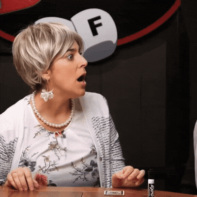 Woman Holding Marker Beside Sign Letter F GIF