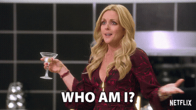 Woman Holding Martini Glass Saying Who Am I GIF