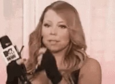 Woman Holding Microphone And Wearing Gloves GIF