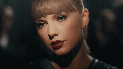 Woman Holding Microphone In Front Of Fox Sign GIF