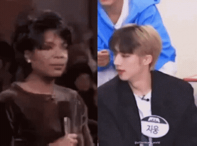 Woman Holding Microphone Next To Man In Blue Jacket GIF