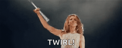 Woman Holding Microphone On Stage Saying Twirl GIF