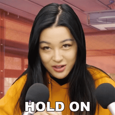 Woman Holding Microphone Saying Hold On GIF