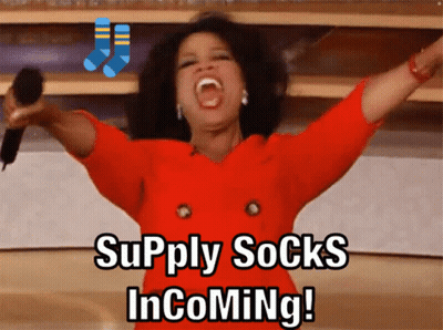 Woman Holding Microphone Saying Supply Socks Incoming GIF