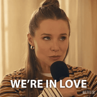 Woman Holding Microphone Saying We're In Love GIF