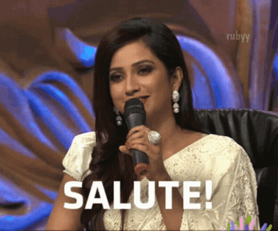 Woman Holding Microphone Says Salute