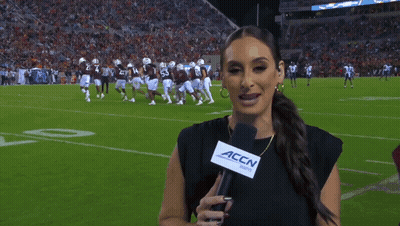 Woman Holding Microphone With 'Accn' Written On It GIF