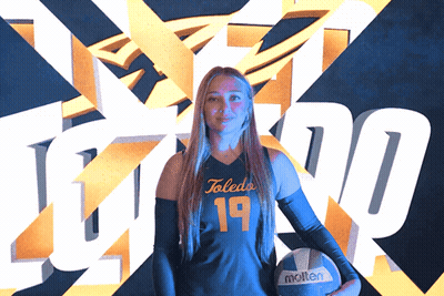 Woman Holding Molten Volleyball In Front Of Toledo Logo GIF