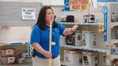 Woman Holding Mop In Front Of Everything Must Go Sign GIF