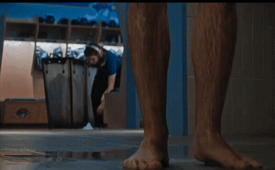 Woman Holding Mug Wearing Camp Combs Shirt GIF