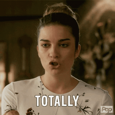 Woman Holding Necklace By Poster Saying I Like The Sound Of That GIF