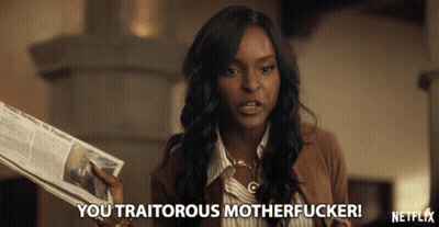 Woman Holding Newspaper Saying You Traitorous Motherfucker GIF