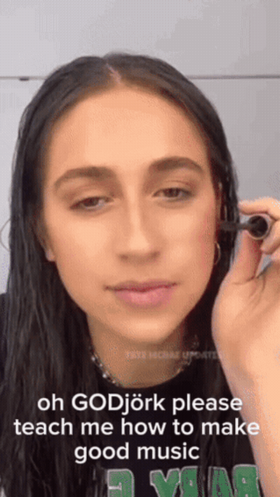 Woman Holding Object Saying Oh Godjork Please Teach Me How To Make Good Music GIF