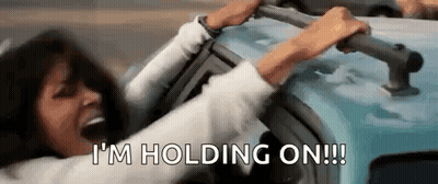 Woman Holding Onto Car Handles GIF