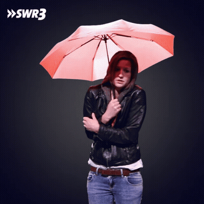 Woman Holding Orange Umbrella In Front Of SWR3 Sign GIF