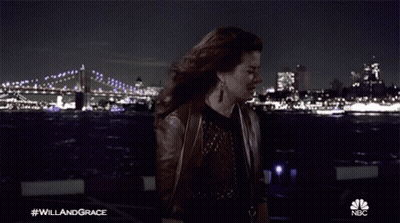 Woman Holding Paper In Front Of Bridge #WillAndGrace GIF