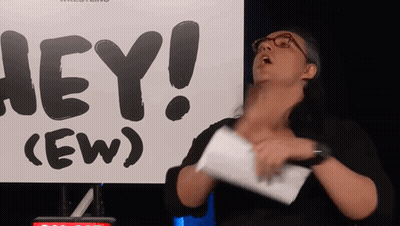 Woman Holding Paper In Front Of Hey Ew Sign GIF