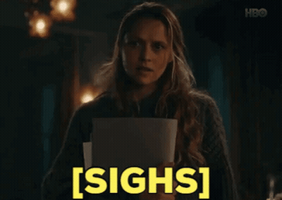 Woman Holding Paper Making Funny Face GIF