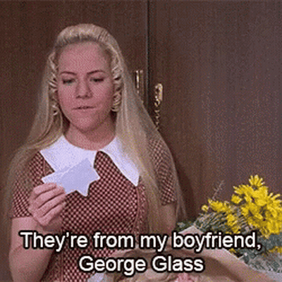 Woman Holding Paper Saying George Glass GIF