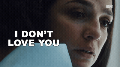 Woman Holding Paper Saying I Don't Love You GIF