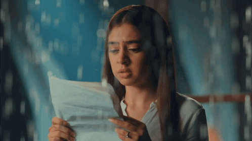 Woman Holding Paper Saying I Love You GIF