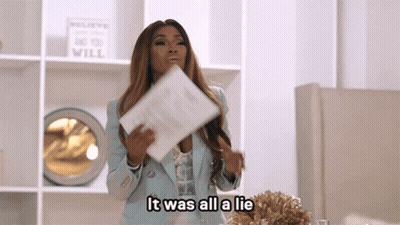 Woman Holding Paper Saying It Was All A Lie GIF